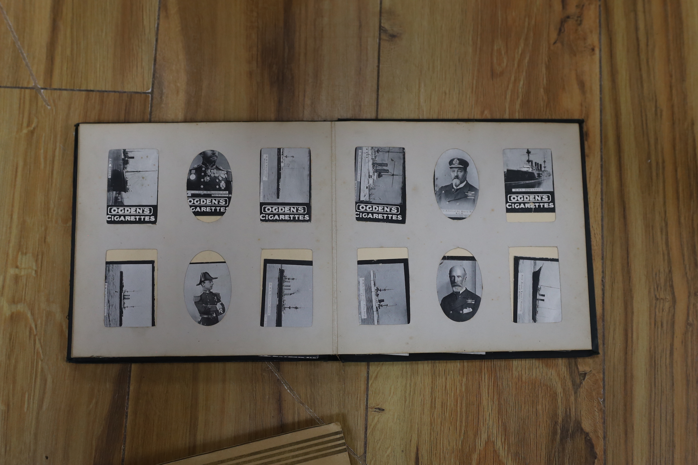 A collection of cigarette cards in albums